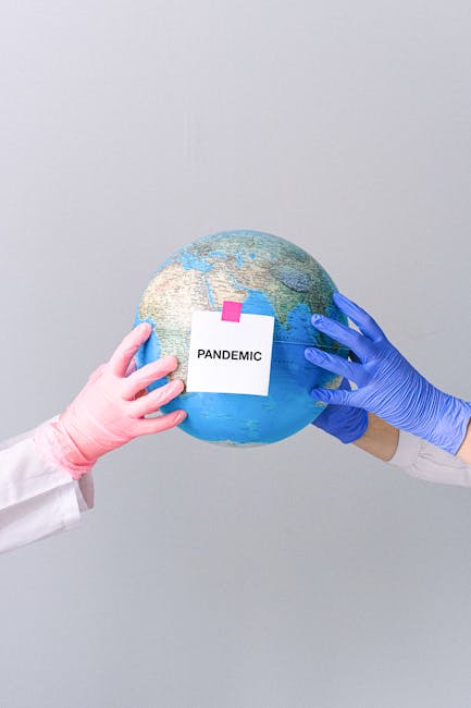 3 : img_1 - Globe labeled Pandemic being held